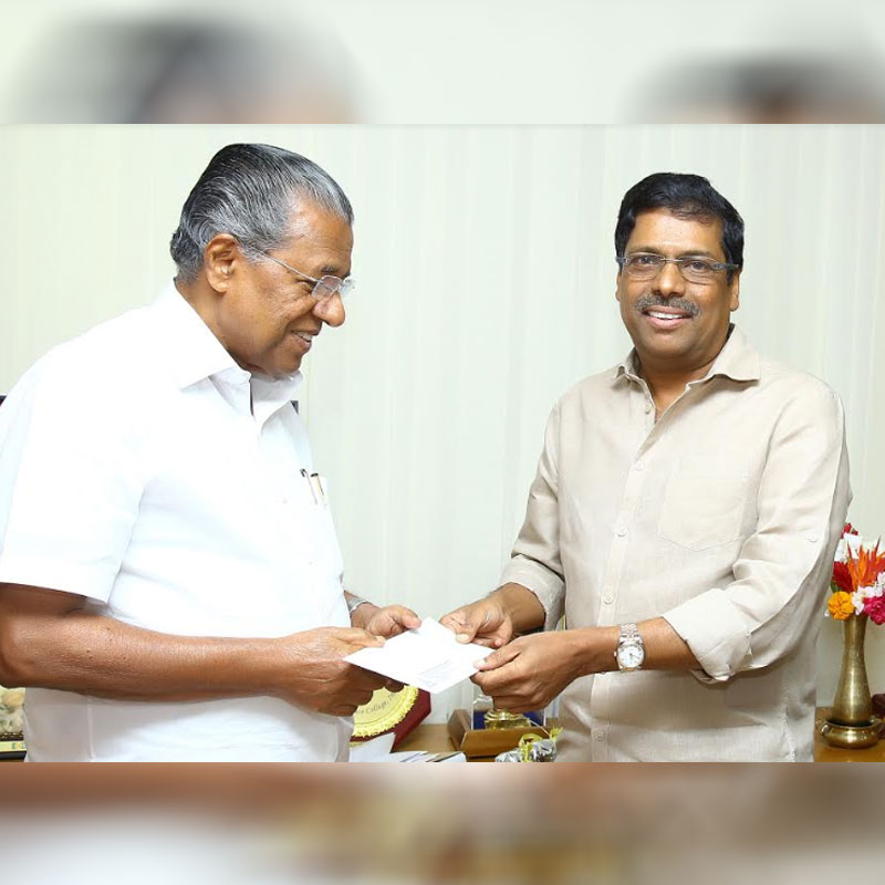 K Madhavan presents the cheque to Kerala CM Shri Pinarayi Vijayan
